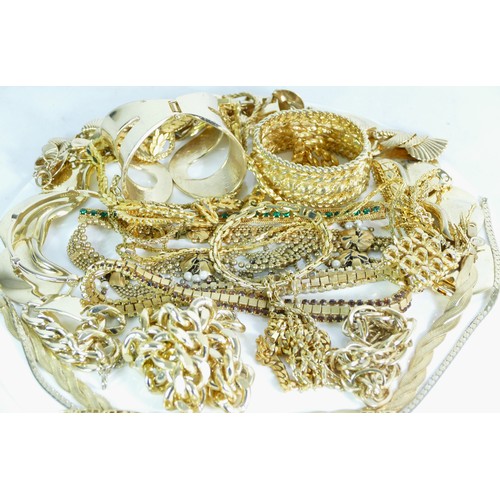 144 - A group of gold plated jewellery to include chains and bangle bracelets, 1000gm.