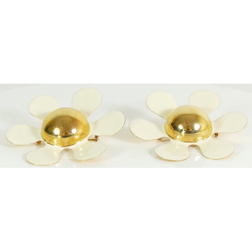 148 - Moschino, two matching flower gold plated brooches, 7.5cm.