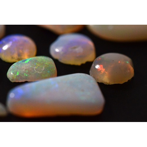 161 - Loose free form cut Opals, flashes of blue, red, orange, green, Cooper Pedy Australia, total weight ... 