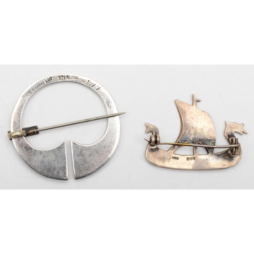 174 - An Elizabeth II silver Viking ship brooch, Edinburgh 1989, and a silver penannular stamped sterling,... 