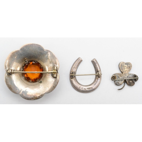 175 - Three Scottish silver hardstone brooches to include a horseshoe, Birmingham 1907, 3.5cm,  33gm.