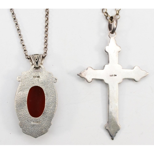 190 - Two silver Ba Suarti pendants on chains one set with carnelian, 48gm.