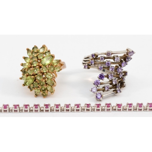 207 - Two silver cluster dress rings, Size U and P-Q, together with a silver ruby tennis bracelet, 30gm.