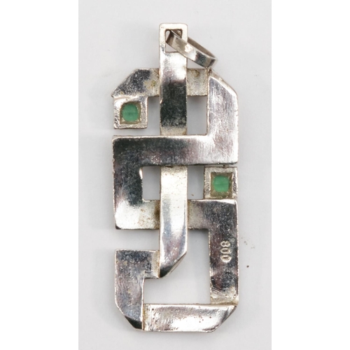 209 - A 800 silver Modernist pendant set with two synthetic emeralds, 4.5cm, together with a Modernist cuf... 