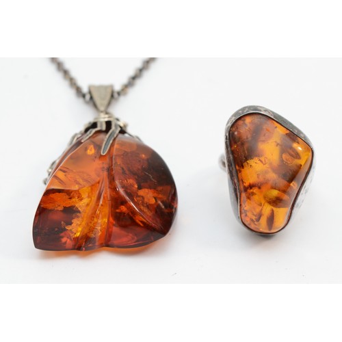 214 - A silver baltic amber necklace and ring, size P, 29gm.