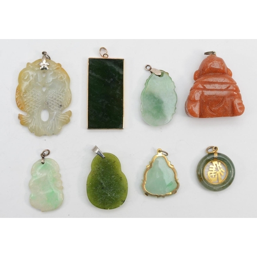 235 - Eight oriental hard stone pendants to include nephrite and jade, 75gm.