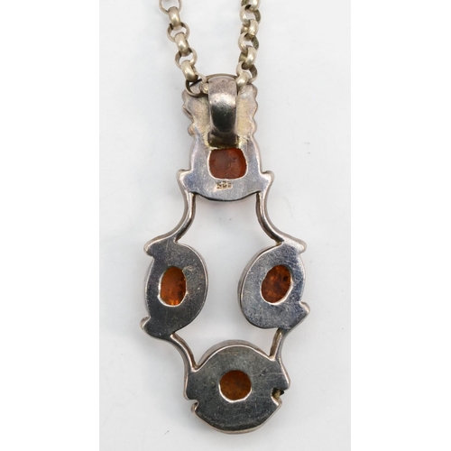 238 - A silver Modernist Baltic amber pendant on belcher chain, 51cm, 39gm.