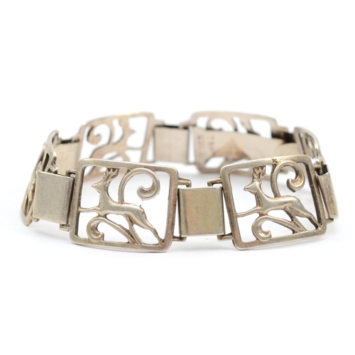 253 - C. Brumberg Hanson, a .830 silver paneled bracelet with deer, length 19cm, 21gm.