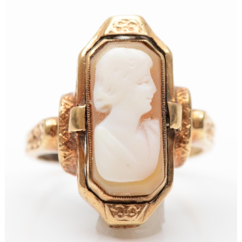 287 - An American 10K gold shell cameo/diamond set onyx panel swivel ring, signed Romany, for Stern & Ster... 