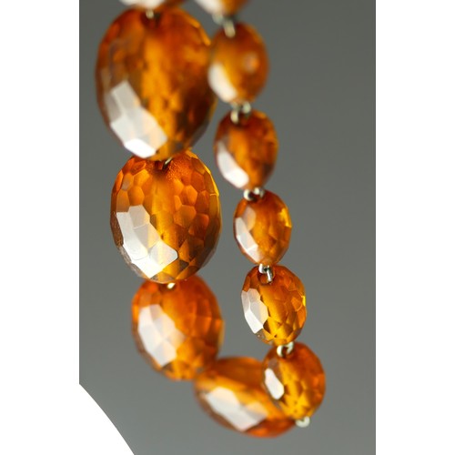 304 - A sterling silver and faceted amber Bakelite graduated bead necklace, 24 - 8mm beads, 53cm, 31gm