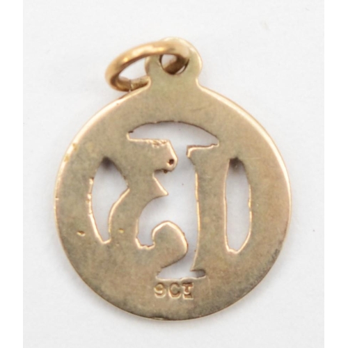 309 - A 9ct gold enameled lucky 13 charm, 1cm, .8gm.