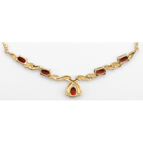 324 - A 9ct gold diamond and garnet necklace, 42cm, 6.1gm.