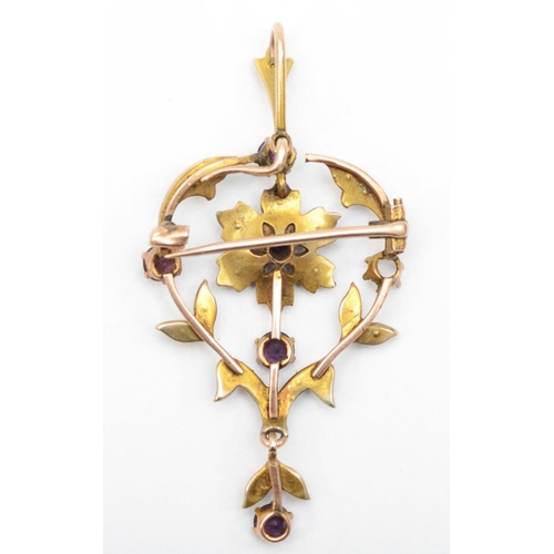 331 - An Edwardian gold openwork amethyst and seed pearl pendant/brooch, 4cm, 3.9, one setting vacant.