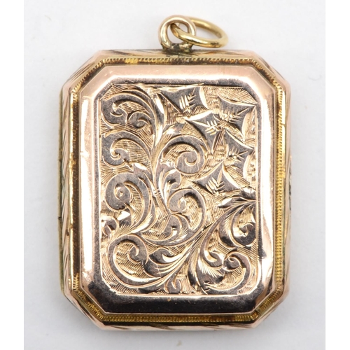 333 - A Victorian gold front and back rectangular locket with scrolling engraving, 2.5 x 2.2cm, 6.3gm.