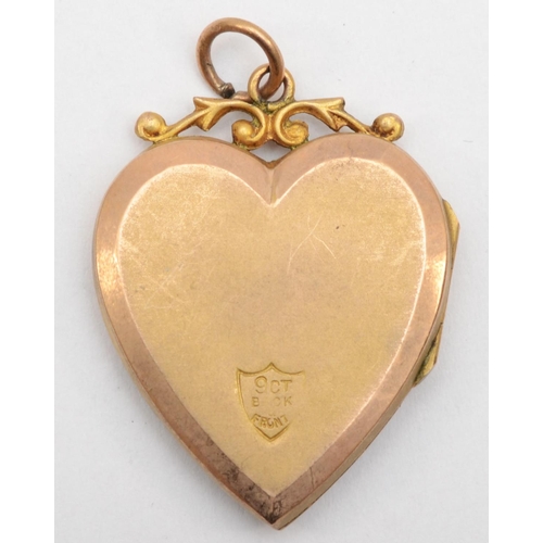 334 - A Victorian 9ct gold front and backed heart shaped locket with seed pearls, 3 x 2 cm.