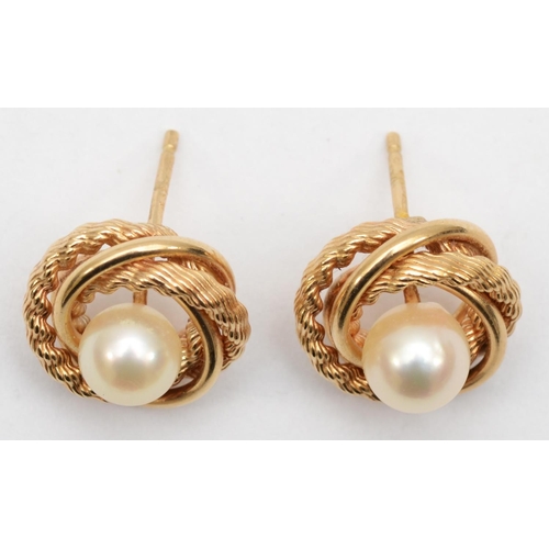 340 - A 375 gold pair of cultured pearl earrings with rope twist border, 1.5cm, 2.9gm