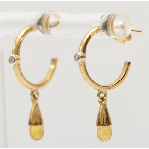 342 - A 9k gold pair of diamond and yellow sapphire hoop earrings, 2.5cm, 1.7gm.