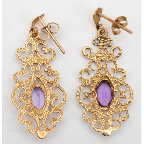 344 - A 9ct gold pair of amethyst open work drop earrings, 3cm, 2.1gm.