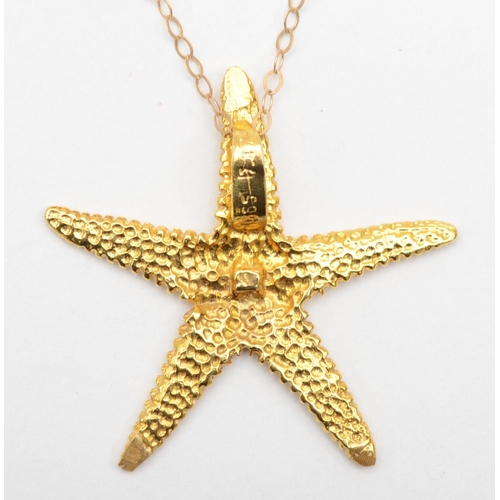 370 - A vintage 585 gold starfish pendant, 28mm, on 9k fine link chain, 40cm, 2.5gm.