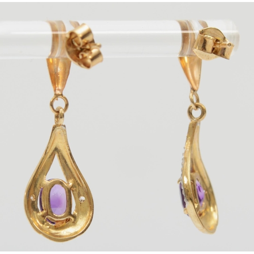 380 - A 9ct gold pair of diamond and amethyst drop earrings, 2.7cm, 2gm.