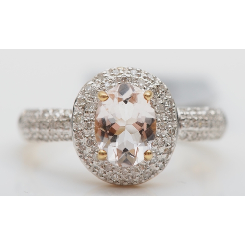 521 - A 9K gold morganite and diamond cluster ring, M 1/2, 2.6gm