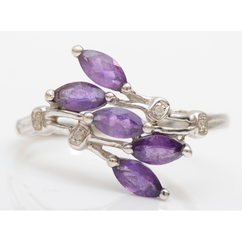 526 - A 9ct white gold, amethyst and diamond dress ring, T, 2.7gm