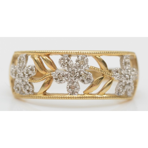 529 - A 9ct gold and diamond openwork floral ring, T. 2.8gm