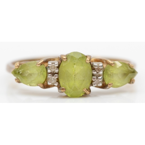 531 - A 9ct gold green topaz and diamond three stone ring, R, 2.1gm