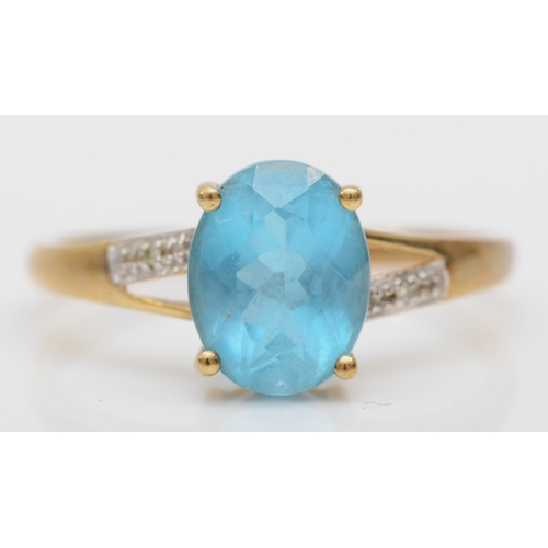 538 - A 9ct gold topaz and diamond ring, T. 2.2gm