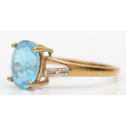 538 - A 9ct gold topaz and diamond ring, T. 2.2gm