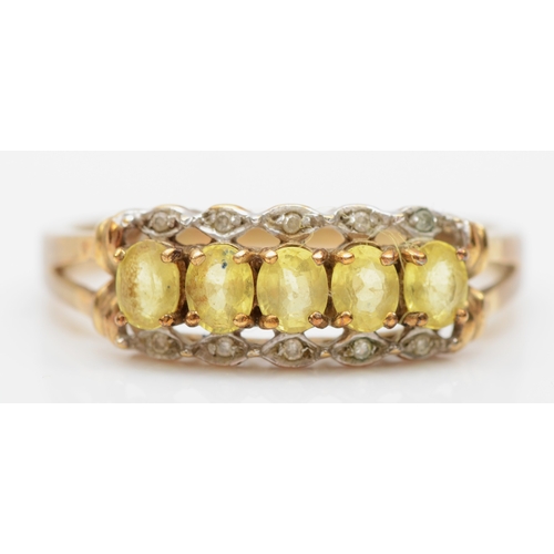 540 - A 9ct gold yellow gemstone and diamond dress ring, S, 2.6gm