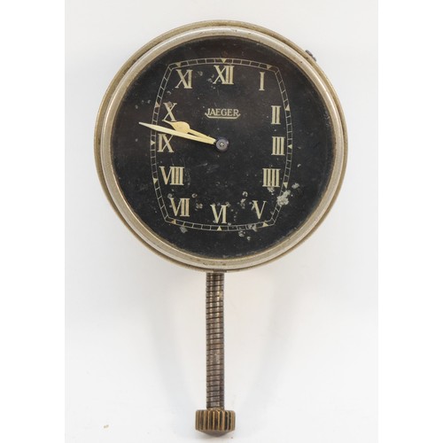 77 - A vintage brushed metal cased Jaeger car clock, the black dial with white Roman numerals, outer case... 