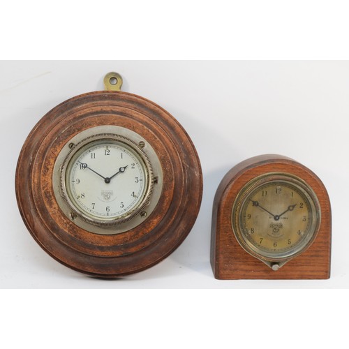 78 - An early 20th century Smiths of London oak cased dome topped car dashboard clock, the dial with blac... 