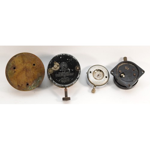 79 - A group of four 20th century dashboard clocks comprising Smiths of London, the black dial with white... 