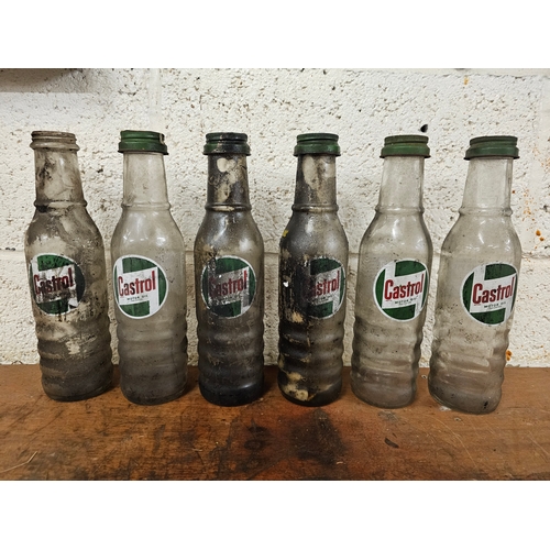 80 - A set of six Castrol glass one pint bottles, all with caps