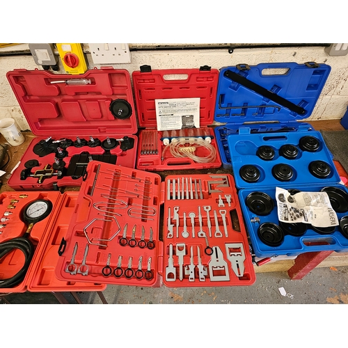 110 - A 15 piece cup oil filter wrench set, a radio removal kit and other tools, mainly unused