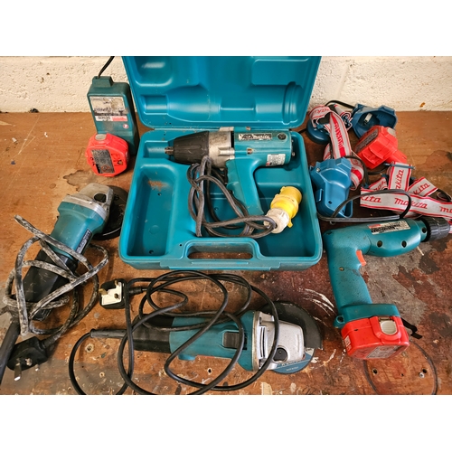 125 - A Makita drill 8411D, two head torches, two 240V angle grinders, all working and an untested 110v im... 