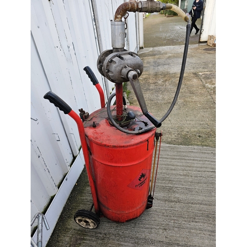 131 - A fluid removal device, trolley mounted, with hand crank