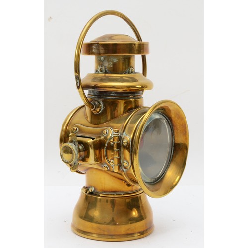 200 - A brass era Duco by Brown brothers oil fired side lamp, 29cm.