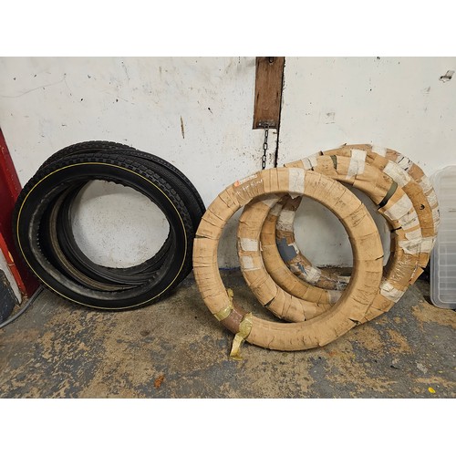 246 - Four Michelin veteran bead edge tyres, 650/65, a pair of Dunlop Clipper 26 - 2 1/4 tyres, and a pair... 