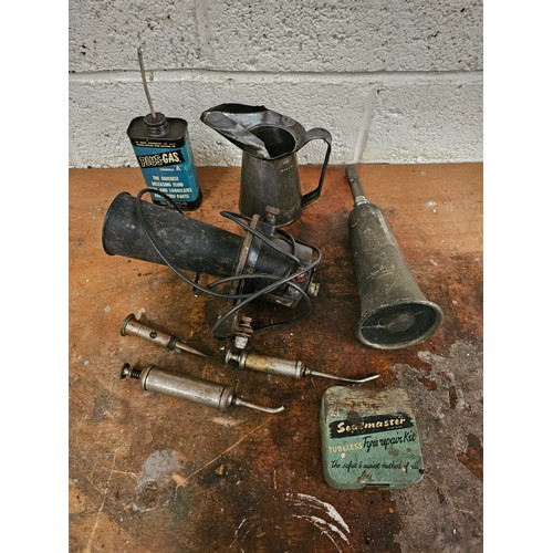 254 - A Sealmaster tyre repair kit, three oilers, two horns and two oil cans.