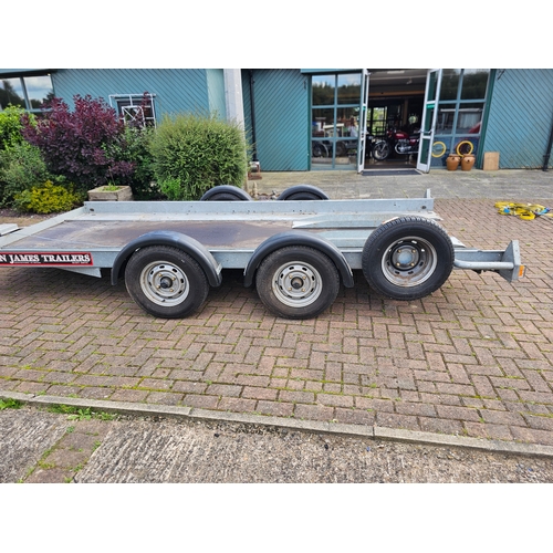 276 - A Brian James, twin axle car trailer, up to 2700KG, with two ramps, manual winch and spare wheel, th... 