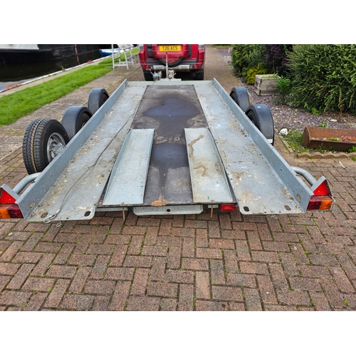 276 - A Brian James, twin axle car trailer, up to 2700KG, with two ramps, manual winch and spare wheel, th... 