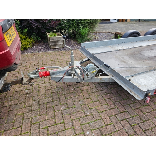 276 - A Brian James, twin axle car trailer, up to 2700KG, with two ramps, manual winch and spare wheel, th... 