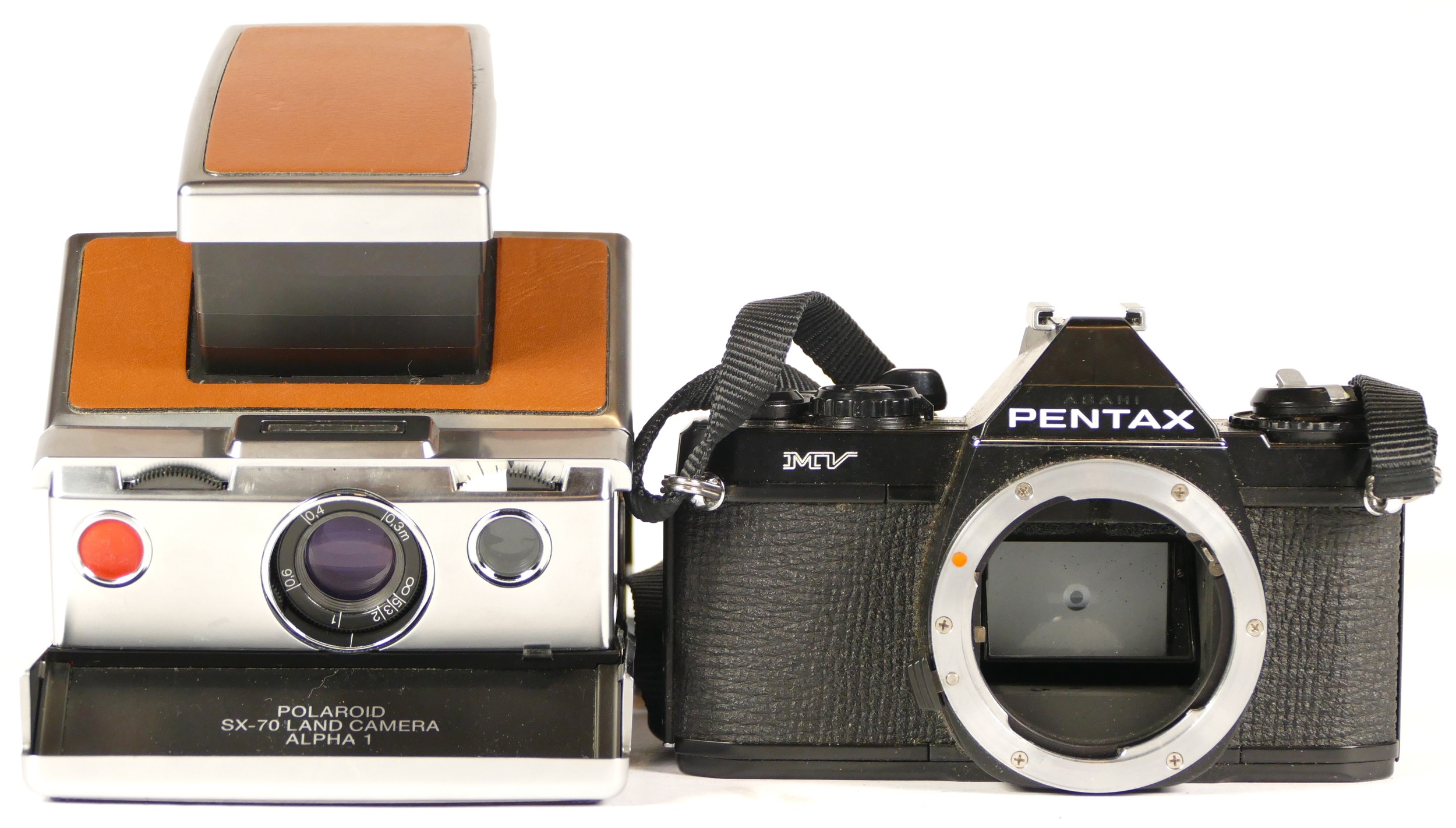 A Pentax MV camera (working) together with a Polaroid SX70 Alpha 1