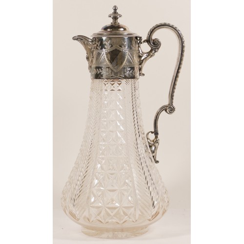 46 - An early 20th century electroplate and pressed glass claret jug, with scrolling handle, bright cut f... 