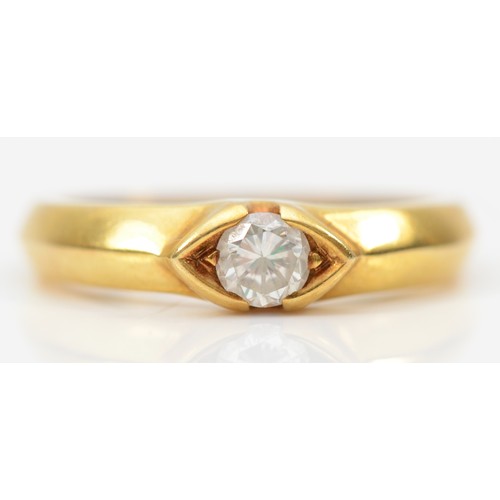 63 - An 18k gold Diamond solitaire ring, the diamond weighing approximately .32ct within an elliptical se... 