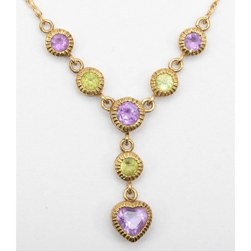 65 - A 9ct gold peridot and amethyst necklace, 48cm, pendant 2cm drop, 2gm.