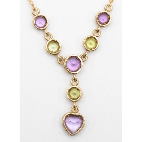 65 - A 9ct gold peridot and amethyst necklace, 48cm, pendant 2cm drop, 2gm.