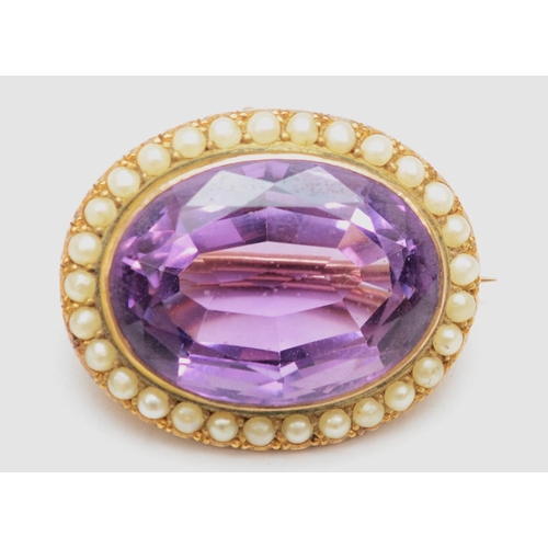 71 - A Victorian unmarked gold amethyst and seed pearl oval brooch, stone 25 x 19mm, 11.1gm.